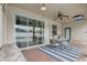 Covered patio with sliding glass doors, fan, outdoor seating, and view of the pool at 440 Skyview Pl, Chuluota, FL 32766