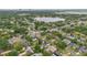 High-altitude aerial shot of a lakeside community and residential neighborhood; with lake and city skyline in the distance at 4436 Larado Pl, Orlando, FL 32812
