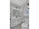 Bathroom with modern vanity, a decorative mirror, and tiled floors at 4436 Larado Pl, Orlando, FL 32812