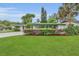 Charming single-story home with a well-manicured front lawn and covered porch at 4436 Larado Pl, Orlando, FL 32812