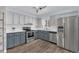 Updated kitchen featuring stainless steel appliances, white countertops, and two-tone cabinets at 4436 Larado Pl, Orlando, FL 32812