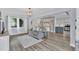 Open-concept living room featuring a comfortable gray sofa and natural light at 4436 Larado Pl, Orlando, FL 32812