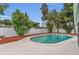 Backyard swimming pool surrounded by a white vinyl fence and landscaping at 4436 Larado Pl, Orlando, FL 32812