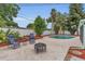 Outdoor pool area featuring seating, fire pit, and a white vinyl fence at 4436 Larado Pl, Orlando, FL 32812