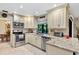 Well-equipped kitchen with modern appliances, granite countertops, and ample cabinet space at 445 Songbird Way, Apopka, FL 32712
