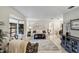 Open living room showcasing a bay window, marble floors, and comfortable seating arrangement at 445 Songbird Way, Apopka, FL 32712