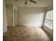 Bright bedroom features tile flooring and a large window at 5120 Lazy Lake Cir, Orlando, FL 32821