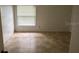 Bedroom featuring tile floors and a window with horizontal blinds at 5120 Lazy Lake Cir, Orlando, FL 32821