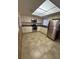 Well-lit kitchen features stainless steel appliances and white cabinetry at 5120 Lazy Lake Cir, Orlando, FL 32821