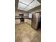 Well-lit kitchen features stainless steel appliances and white cabinetry at 5120 Lazy Lake Cir, Orlando, FL 32821