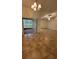 Bright living room offers ample space and tile flooring throughout at 5120 Lazy Lake Cir, Orlando, FL 32821