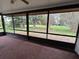 Spacious screened-in porch with views of the lush backyard, perfect for outdoor relaxation at 5120 Lazy Lake Cir, Orlando, FL 32821