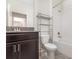 Bathroom featuring double vanity with granite countertop and modern fixtures, next to a shower and toilet at 5871 Alenlon Way, Mount Dora, FL 32757