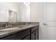 Bathroom featuring double vanity with granite countertop and modern faucets at 5871 Alenlon Way, Mount Dora, FL 32757