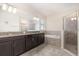 Modern main bathroom featuring dual vanities, a soaking tub, and a walk-in shower at 5871 Alenlon Way, Mount Dora, FL 32757