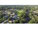 Aerial view showcases homes surrounded by lush greenery and trees at 611 Green Briar Blvd, Altamonte Springs, FL 32714