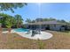 Wide backyard shot with a pool, patio, outdoor seating, and grass at 611 Green Briar Blvd, Altamonte Springs, FL 32714