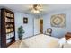 Bedroom with light blue walls, full closet, white bedding and bookcase at 611 Green Briar Blvd, Altamonte Springs, FL 32714