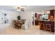 Open dining room adjacent to the kitchen with granite countertops and breakfast bar at 611 Green Briar Blvd, Altamonte Springs, FL 32714