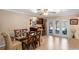 Bright dining area with glass table, seating for six, and access to the outdoor pool at 611 Green Briar Blvd, Altamonte Springs, FL 32714