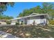 Charming single-story home featuring a well-manicured lawn and attached two-car garage at 611 Green Briar Blvd, Altamonte Springs, FL 32714
