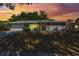 Charming single-story home with well-maintained lawn and attached two-car garage at sunset at 611 Green Briar Blvd, Altamonte Springs, FL 32714