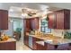 Updated kitchen featuring granite countertops, stainless steel appliances, and wooden cabinetry at 611 Green Briar Blvd, Altamonte Springs, FL 32714