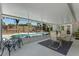 Screened lanai with a table, chairs, string lights, and a view of the pool at 611 Green Briar Blvd, Altamonte Springs, FL 32714