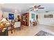 Open-concept living room with tile floors, built-in shelving, and multiple seating areas at 611 Green Briar Blvd, Altamonte Springs, FL 32714