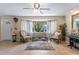 Bright living room with neutral walls, large windows, and cozy seating arrangement at 611 Green Briar Blvd, Altamonte Springs, FL 32714