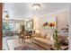 Comfortable living room with a cream sofa, artwork, and views of the neighborhood at 611 Green Briar Blvd, Altamonte Springs, FL 32714