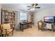 Home office with built-in bookshelves, natural lighting, and comfortable seating at 611 Green Briar Blvd, Altamonte Springs, FL 32714