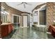 An opulent primary bathroom featuring a large soaking tub with unique decor and glass block window at 612 Stonefield Loop, Lake Mary, FL 32746