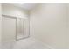 A bedroom with tile floors and mirrored closet doors at 612 Stonefield Loop, Lake Mary, FL 32746