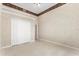Carpeted bedroom with large closet and neutral decor at 612 Stonefield Loop, Lake Mary, FL 32746