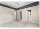 A large bedroom featuring a ceiling fan and multiple doorways at 612 Stonefield Loop, Lake Mary, FL 32746