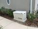 Exterior side shot of a home featuring a generator installed next to the house at 612 Stonefield Loop, Lake Mary, FL 32746