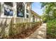 A home exterior with beautiful windows and lush landscaping at 612 Stonefield Loop, Lake Mary, FL 32746
