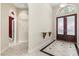 Elegant foyer with marble floors, high ceilings, and a decorative front door at 612 Stonefield Loop, Lake Mary, FL 32746