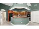 Well-equipped kitchen with wood cabinets, granite counters, and black appliances at 612 Stonefield Loop, Lake Mary, FL 32746