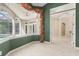 Bright sun room overlooking the swimming pool with stylish décor and tile flooring at 612 Stonefield Loop, Lake Mary, FL 32746
