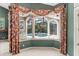 Enclosed sun room with a pool view, wet bar, and tile flooring at 612 Stonefield Loop, Lake Mary, FL 32746