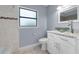Bathroom featuring modern vessel sink, granite counters, updated fixtures, and tile at 6431 Greylynne St, Orlando, FL 32807