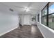 Bedroom with large windows, new wood flooring, and neutral paint at 6431 Greylynne St, Orlando, FL 32807