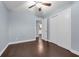 Bedroom with closet, new wood flooring, neutral paint and a ceiling fan at 6431 Greylynne St, Orlando, FL 32807