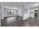 Bright living space featuring modern flooring, freshly painted walls, and an open layout at 6431 Greylynne St, Orlando, FL 32807