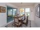 Cozy dining room with natural light and view of the backyard at 6960 Audobon Osprey Cv, Harmony, FL 34773