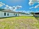 This shot shows a spacious, grassy backyard with a white fence around the edge, creating a clean and private outdoor space at 701 Marion Oaks Trl, Ocala, FL 34473