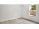 Simple bedroom design features light wood floors and a window for natural light at 701 Marion Oaks Trl, Ocala, FL 34473