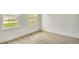 Bright bedroom features two windows and durable floors at 701 Marion Oaks Trl, Ocala, FL 34473